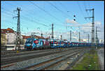 DPB Rail Infra Service GmbH 1216 940-7 mit dem Milsped-Autozug am 24.02.2024 in Würzburg. 