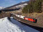 Die 1293 028 mit einer RoLa am 23.02.2019 unterwegs bei Matrei am Brenner.