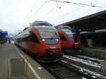 Links 4023 010-4 als R 4614 (Villach Hbf - Sillian), rechts 4024 123-4 als R 4252 (Sillian - Friesach).
Aufgenommen am 4.12.2014 in Lienz.