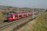 4024 103 (HAUPTÖBBHOF) und ein weiterer 4024 fahren am 25.02.2014 als Schnellbahnzug durch die Weingärten bei Pfaffstätten.