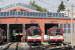 Salzburger Lokalbahn ET 54 + ET 47 // Salzburg; SLB-Betriebswerk (aufgenommen von einem Bahnübergang) // 1.