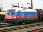 Die Ruland-Lok 1116 084-3 vor einem Gterzug im Bahnhof Tulln.