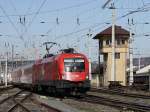 Die 1116 075 (EM Schweiz) am 28.03.2009 bei der Einfahrt in den Salzburger Hbf.