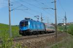 1116 080 mit OIC 690 von Wien West nach Klagenfurt Hbf am 25.04.2009 unterwegs bei Seekirchen am Wallersee.