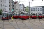 Wien Wiener Linien: Im Betriebsbahnhof Favoriten halten am Morgen des 1. Mai 2015 die Wagen A 9, E2 4312, E2 4095, E2 4077, E1 4515 und E2 4093.