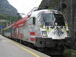 ÖBB 1116 246-8  Bundesheer  mit dem EC 668  H2O-Hotel-Therme-Resort  von Graz Hbf nach Bregenz hier beim Zwischenhalt in Imst-Pitztal. Aufgenommen am 13.05.2009