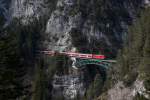 DB 111 005 zieht am 04.04.13 einen Regionalzug ber die berhmte Schlossbachbrcke auf der Mittenwaldbahn.