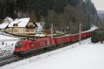 1116 143 (Cargo-Montan) mit Güterzug bei Langenwang am 9.12.2013.