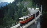 Die 1099 009-1 der Mariazellerbahn überquert im Juli 1991 auf ihrer Fahrt nach Mariazell den Saugrabenviadukt