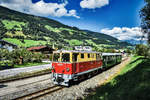 2095.01 fährt mit dem Sdz 902 (Zell am See - Krimml), aus dem Bahnhof Bramberg aus.