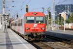 REX2797 mit CS-Steuerwagen 80-73 008 von Wien Sd nach Oberwart bei der Einfahrt in Wien Meidling, 28.05.2009.