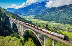 Eine 1116 und eine 1144 überquren mit einem Mischer die Falkensteinbrücke bei Obervellach in Richtung Spittal.