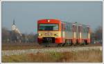 VT 70.12 von Graz nach Wies-Eibiswald am 2.12.2007 kurz nach Gr. St. Florian, mit der Kirche von Gr. St. Florian im Hintergrund.