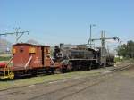 Eine frisch retablierte 19D (Kohlefeuerung) mit Van der Bilt Tender wartet in der Ausfahrgruppe der Lokmanufaktur Dal Josafat mit einem Messwagen auf ihre nchste Aufgabe. Mrz 2002