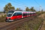 REX 9437 ist von Wien Hbf. nach Gyr unterwegs. Himberg, am 04.10.2013.