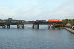 Just after sunrise, 720 & 425 cross Crane Creek, Melbourne whilst working a stone train from Medley to City Point, 6 Feb 2020