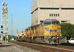 6778 & 4984 depart the Port of Beaumont with a train of military vehicles. In the background is the Neches River lift bridge, 22 March 2018