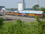 BNSF 8825 leads a 5-pack of dieselloks with a mixed freight through the Burlington, Iowa yard on 26 July 2003.