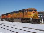 BNSF 8834 & 9148 sit at the Burlington, Iowa depot in Feb 2010. This photo shows clearly how the orange color fades badly with time. It will not be long and 8834 will look like chalk and 9148 will look like 8834 does now. I like orange, but BNSF needs to start using better quality paint!