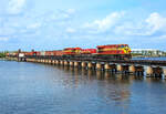 811 & 814 cross the St Lucie River in Stuart whilst hauling train 103 to Miami, 10 March 2022.