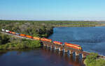 813 & 802 cross Spruce Creek whilst hauling train 105 to Miami, 2 March 2022