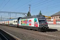 Re 460 099-5, mit der Gottardo/Mobiliar Werbung, durchfährt den Bahnhof Rothrist. Die Aufnahme stammt vom 11.03.2017.