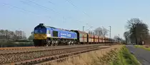 BRLL 266 461  Hans Cermak , vermietet an HHPI, Lok 29001, 
schleppt einen langen Schüttgutwagenzug am 16.03.17 bei Diepholz in Richtung Bremen.