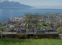 MOB: Am 17. April 2017 wurde die GDe 4/4 6003 mit der Werbung für den Train du Chocolat während dem Zwischenhalt in Chamby auf eine ungewohnte Art fotografiert. Sie ist nur leicht erkennbar vor der Kulisse des  kleinen Sees  bei diesem herrlichen Frühlingswetter.
Foto: Walter Ruetsch 