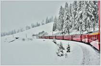 RE1141 mit der Ge 4/4 III oberhalb von Bergün und schon mitten im tiefsten Winter. (27.04.2017)