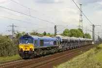 Class66 Heavy Haul Power mit einem Schotterzug in Ahlten, am 13.05.2017.