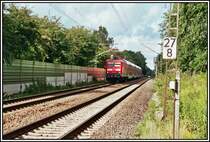 Die heutige Dortmunder 112 158 eilt mit einem RE2  RHEIN-HAARD-EXPRESS  bei Haltern am See dem Ziel M�nchengladbach entgegen. Aufgenommen im Herbst 2005