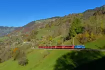 Ge 4/4 II 619 mit einem Regio am 15.10.2017 bei Saas. 