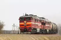 Тепловоз 2ТЭ116-773 компании  Трансойл  с грузовым поездом на перегоне Юровский - Красная Стрела, Северо-Кавказская Железная Дорога.
Diesellokomotive 2TE116-773 der Gesellschaft  Transoil  mit Güterzug auf der Strecke Yurovsky - Krasnaya Strela, Nordkaukasische Eisenbahn.
Diesel locomotive 2TE116-773 of the company  Transoil  with freight train on the Yurovsky - Krasnaya Strela section, the North Caucasian Railway.