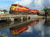 818 & 820 cross Cypress Creek whilst hauling FEC121-20 from Jacksonville Bowden Yard to Miami Hialeah, 21 Nov 2017