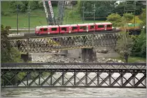 S2 1557 mit ABe 4/16 3102 auf der alten Hinterrheinbrücke in Reichenau-Tamins. (02.05.2018)
