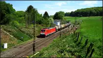 Eine E-186 der DB (Schenker) ist mit ihrer Kesselwagenfuhre am Haken nach Belgien unterwegs. Hier zu sehen am Geussenweg unweit von Aachen am Gemmenicher Tunnel. 
Datiert vom 05.Mai 2018.