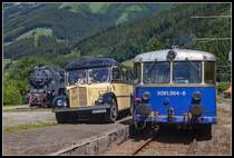 Parade von 297.401, Nostalgiepostbus und 5081.564 in Vordernberg Markt am 1.07.2018.