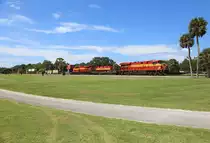 810 & 819 cross Daytona Golf Club whilst hauling FEC101-05 from Bowden to Hialeah, 5 July 2018