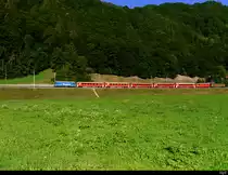 RhB - RE nach Scoul-Tarasp an der Spitze die Ge 4/4 619 unterwegs bei Jenaz am 30.07.2018