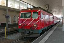 Im Bahnhof von Disentis-Mustér ist R 827 bereitgestellt, den am 04.08.2018 die HGe 4/4 II Nr. 105 nach Andermatt ziehen wird.