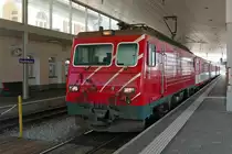 Im Bahnhof von Disentis-Mustér ist R 827 bereitgestellt, den am 04.08.2018 die HGe 4/4 II Nr. 105 nach Andermatt ziehen wird.