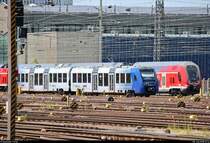 Tele-Blick bei Hitzeflimmern auf 622 919 (Alstom Coradia LINT 54) der vlexx GmbH und 446 027 (DBpzfa | Bombardier Twindexx Vario) des Main-Neckar-Ried-Express (DB Regio Mitte) auf dem Gleisvorfeld von Frankfurt(Main)Hbf.
[8.7.2018 | 13:14 Uhr]