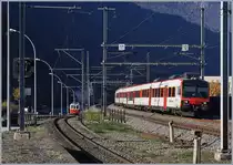 Während der RegioAlps Domino Regionalzug 6117 von St-Gingolph nach Brig in Kürze den Bahnhof von Martigny erreicht, ist der M-C BDeh 4/4 N° 8 im Hintergrund schon auf den Weg nach Vernayaz MC. 

18. Nov. 2018
