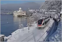 Der SBB Flirt RABe 523 010 hat Villeneuve verlassen und fährt nun vor dem Hintergrund des verschneiten Château de Chillon Richtung Montreux.

29. Jan. 2019