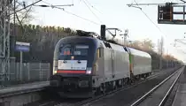 LEO Express GmbH mit dem MRCE Dispo Taurus  ES 64 U2-008  [NVR-Number: 91 80 6182 508-2 D-DISPO] und einem Flixtrain Personenwagen Richtung Bf. Berlin-Lichtenberg am 12.02.19 Durchfahrt Bf. Berlin Hohenschönhausen.