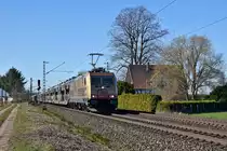 BRLL 185 597, vermietet anHSL Logistik, mit Autotransportzug in Richtung Hannover (bei Stadthagen, 27.02.19). 