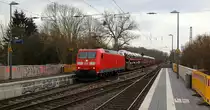 185 046-0 DB kommt als Umleiter aus Richtung Aachen-West mit einem Güterzug aus Muizen(B) nach Köln-Gremberg(D) und fährt durch Kohlscheid und fährt in Richtung Herzogenrath,Wickrath. 
Aufgenommen von Bahnsteig 2 in Kohlscheid.
Bei Sonne und Regenwolken am Vormittag vom 6.3.2019.