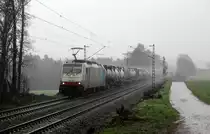 186 494-1 von Lineas/Railpool kommt aus Richtung Aachen-West und fährt die Gemmenicher-Rampe hoch mit einem Containerzug aus Gallarate(I) nach Antwerpen-Combinant(B) aus Richtung Aachen-West und fährt in Richtung Montzen/Belgien. 
Aufgenommen an der Montzenroute am Gemmenicher-Weg. 
Bei Strömenden Regen am Nachmittag vom 7.3.2019. 