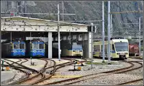 ABe 8/8 22  Ticino  und 23  Ossola , ein Treno Panoramico Vigezzo und Centovalli Express ABe 4/8 48 im Depot Domodossola (I). (10.04.2019)