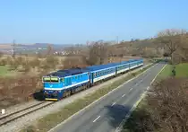 754 062 passes Harvice whilst working train 883, 0545 Hradec Kralove - Luhacovice, 31 March 2019